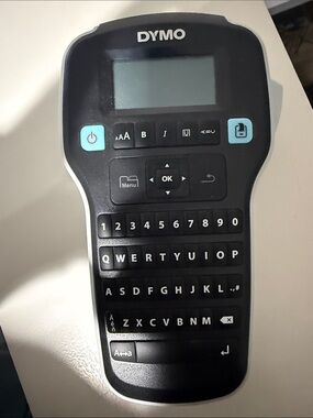 Dymo handheld label maker in black with light blue buttons